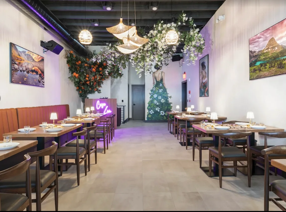The long dining hall with a floral mural