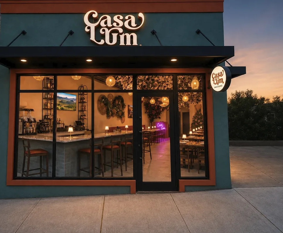 The Casa Lum storefront at dusk with its glowing sign